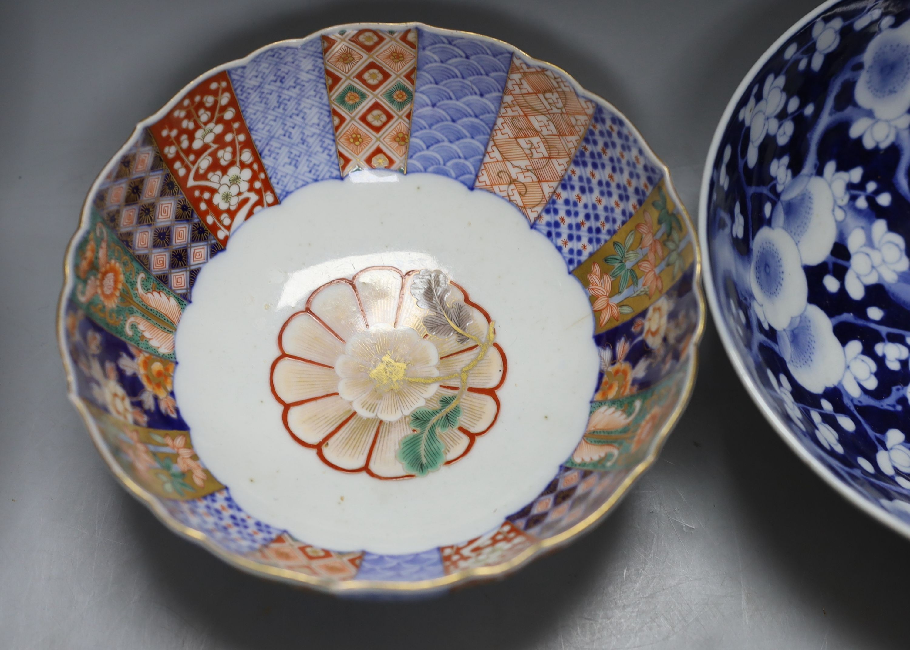 4 Chinese Qing dynasty coins, a Japanese kutani bottle vase, similar vase and cover (a.f), an Imari bowl and blue and white bowl. Largest 27cm